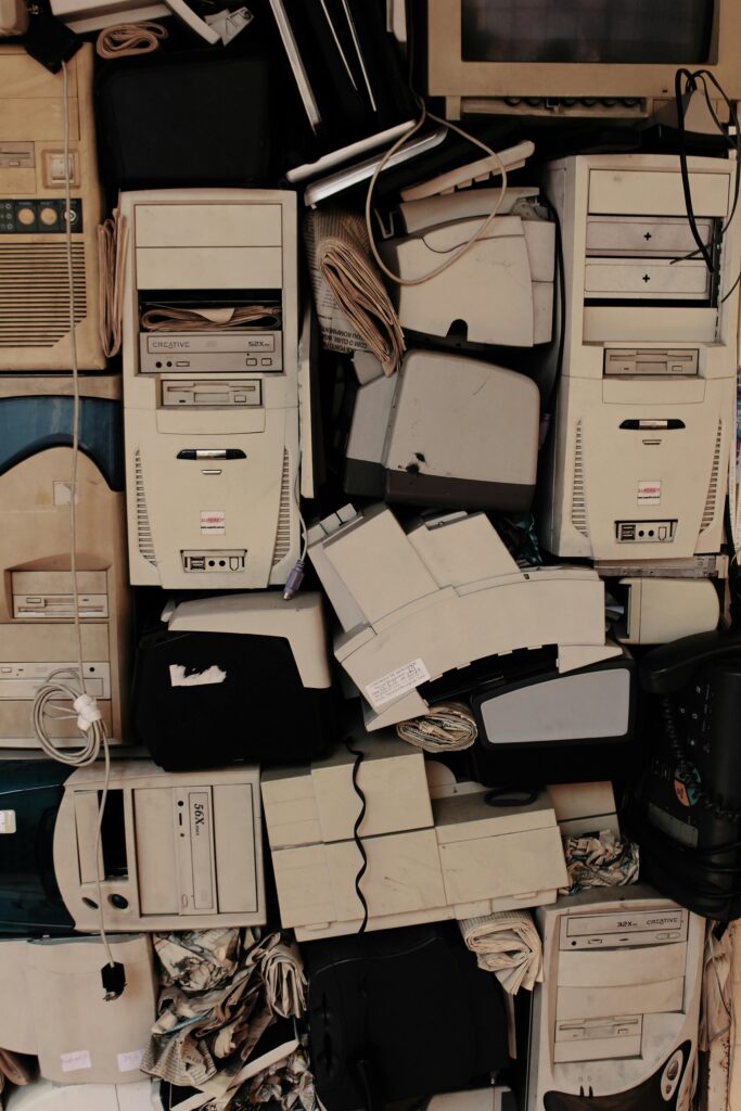 A collection of vintage computer components stacked together, showcasing old technology.